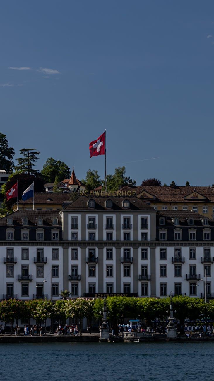 The iconic Schweizerhof Hotel with a Swiss flag