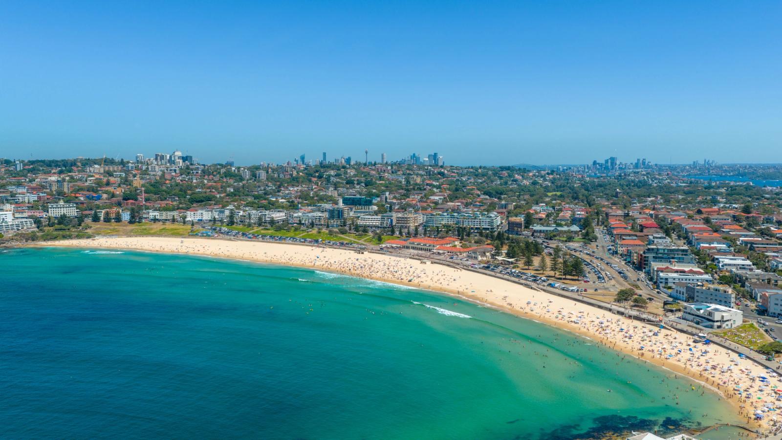Stunning aerial shot of Bondi Beach, Sydney with clear blue skies and vibrant landscape