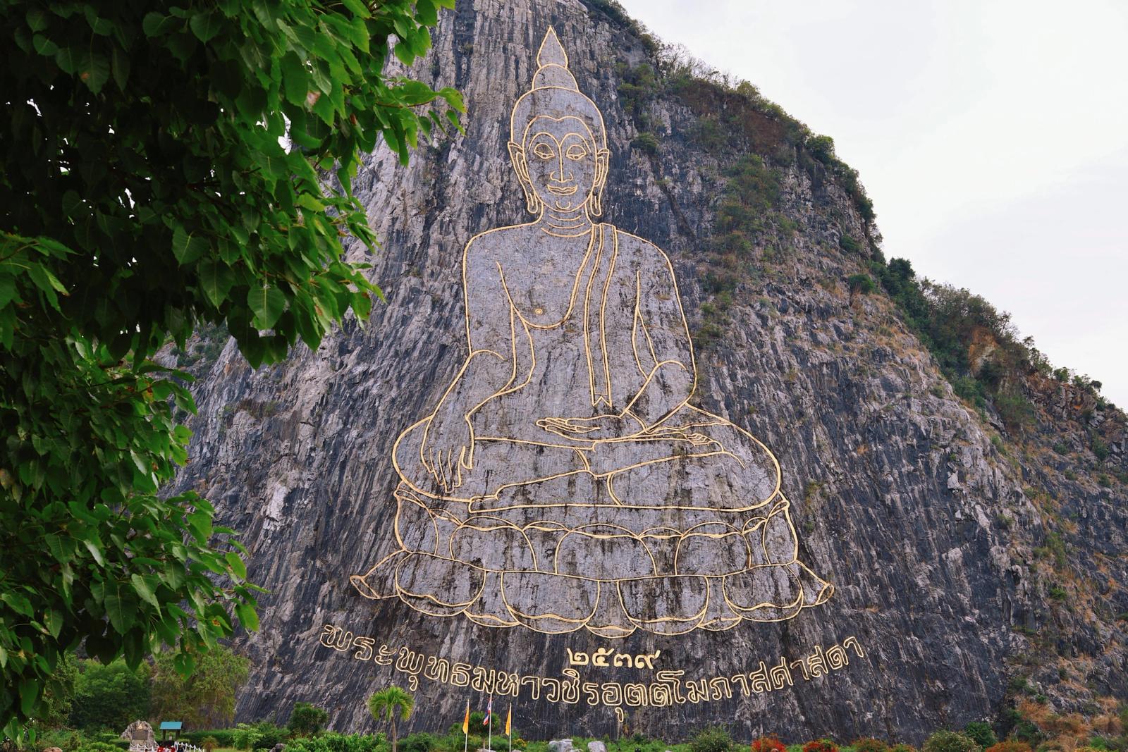 Stunning laser-engraved Buddha on a limestone mountain in Pattaya, Thailand