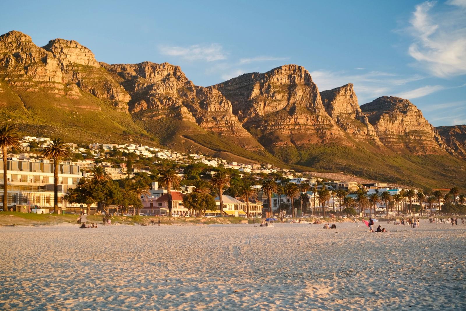 Beautiful sunset view of Camps Bay Beach with the Twelve Apostles in the background, Cape Town
