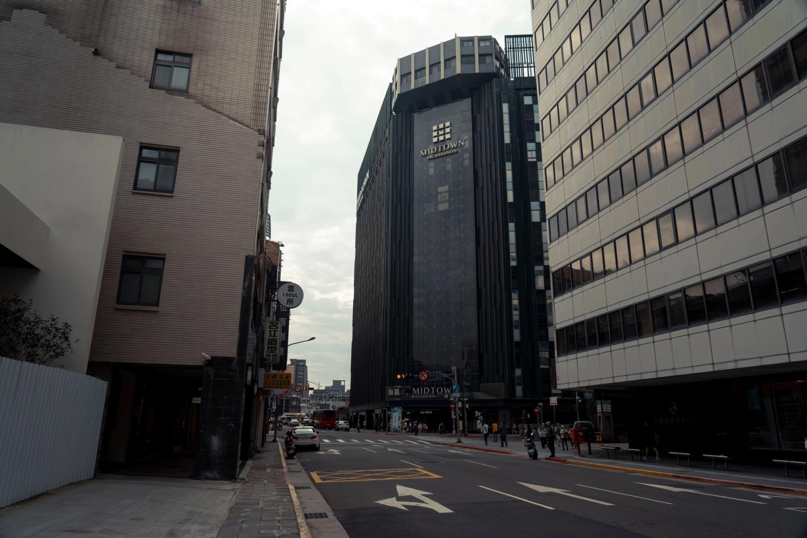View of modern skyscrapers in Taipei's urban downtown district with street scene