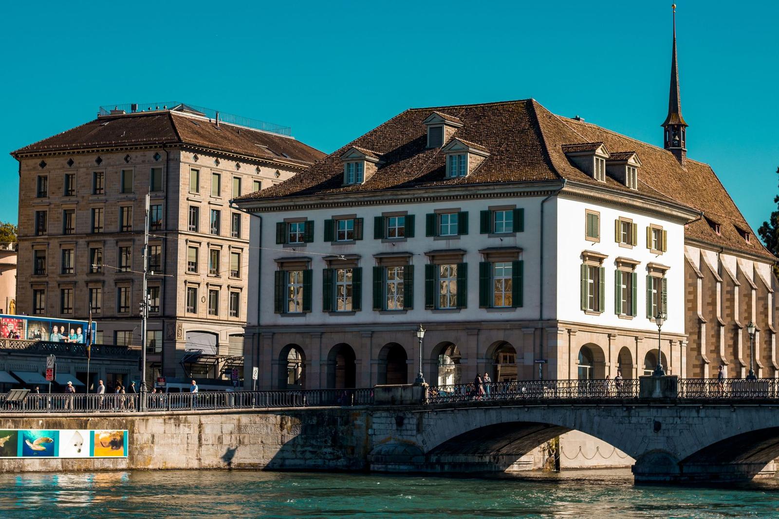 Scenic view of Zürich's historic waterfront and architectural charm on a sunny day