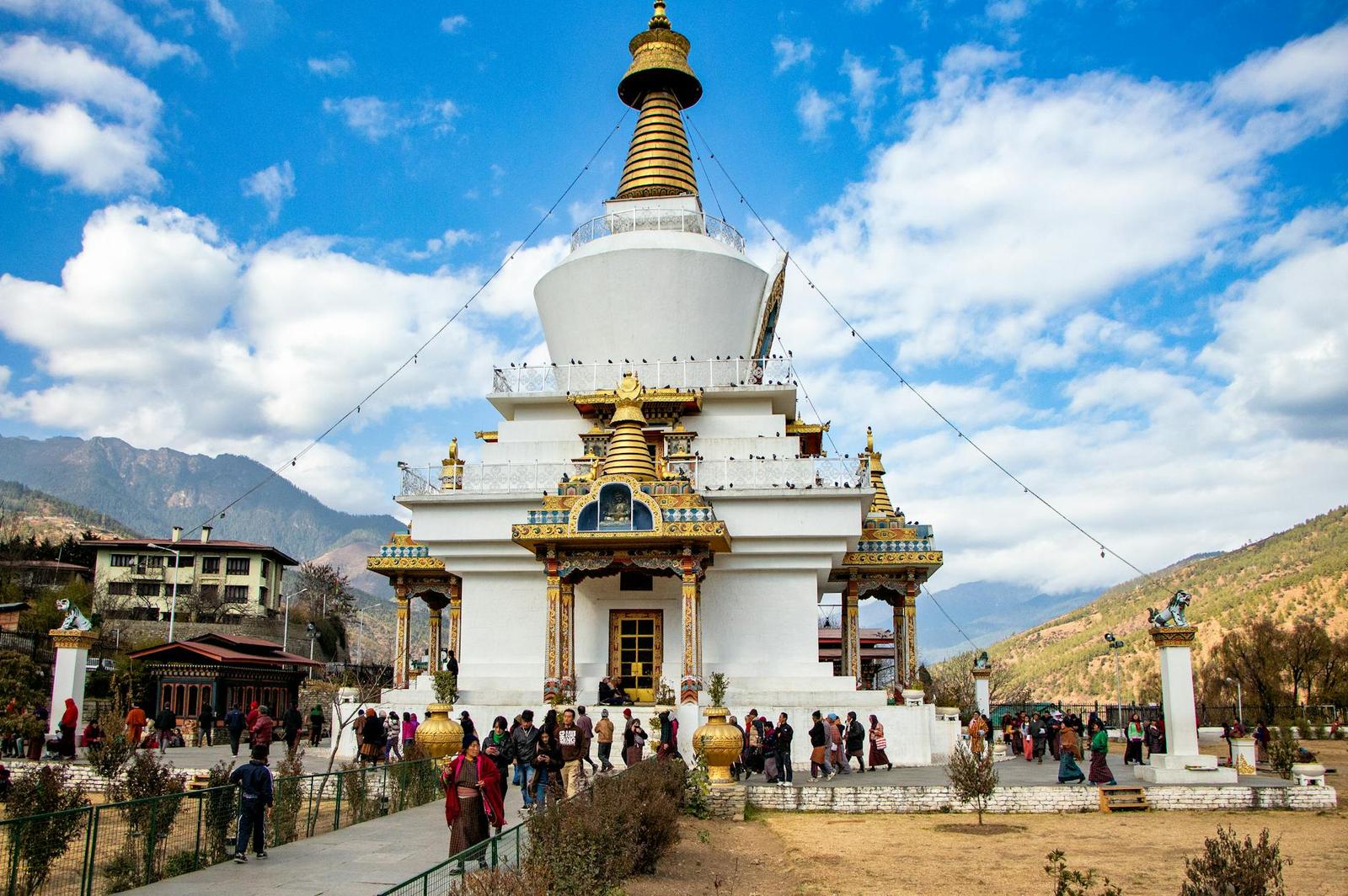 A vibrant view of Memorial Chorten, a religious landmark in Thimphu, Bhutan, surrounded by visitors