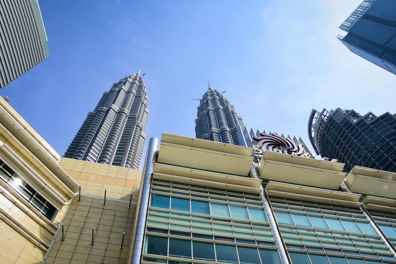 Stunning view of Petronas Towers from the streets of Kuala Lumpur, Malaysia