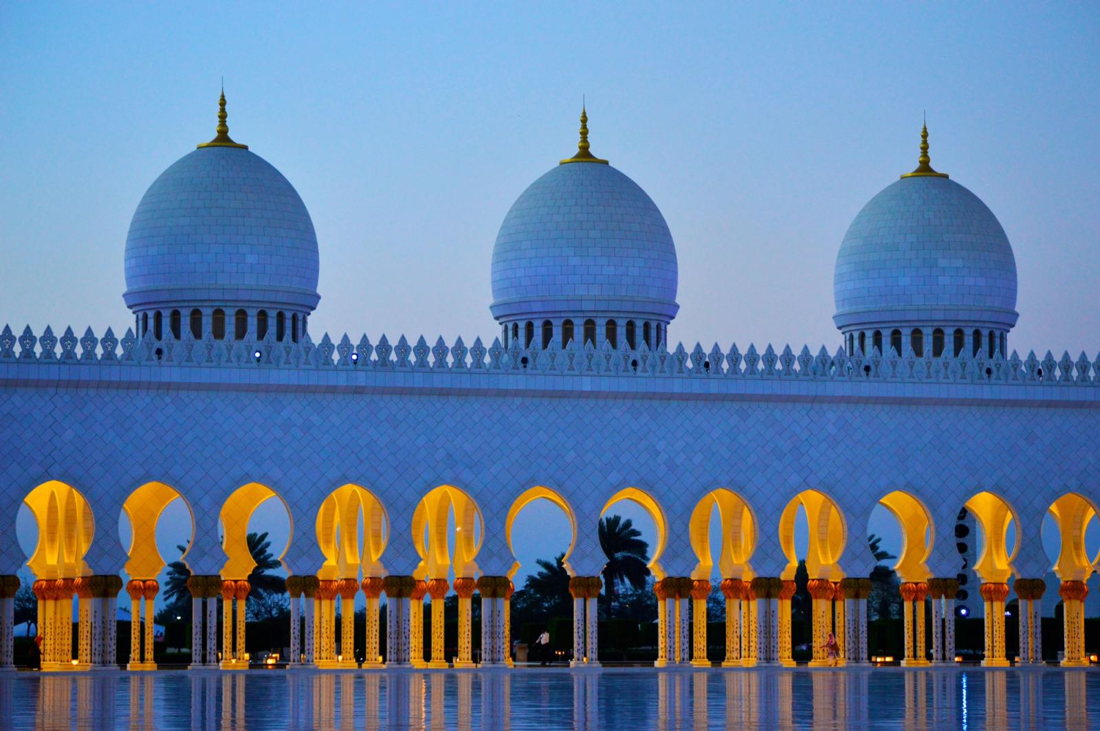 Stunning view of Sheikh Zayed Grand Mosque domes during twilight in Abu Dhabi, UAE