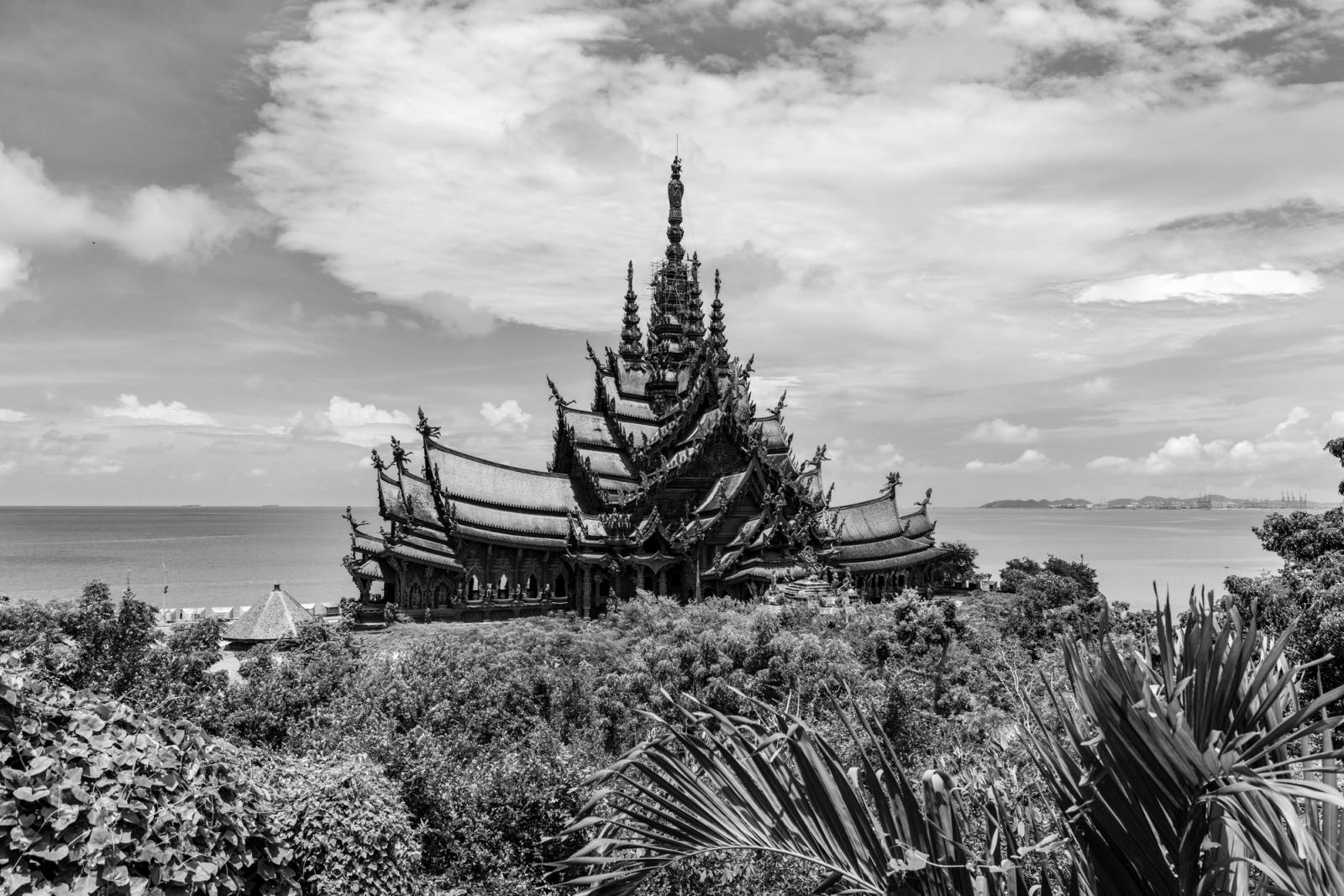 Black and white photo of the intricate Sanctuary of Truth in Pattaya overlooking the sea