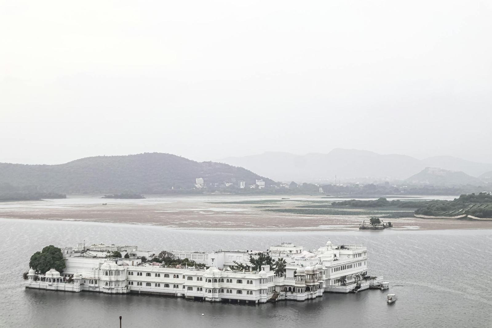 A serene view of the famous Lake Palace on Lake Pichola in Udaipur, India