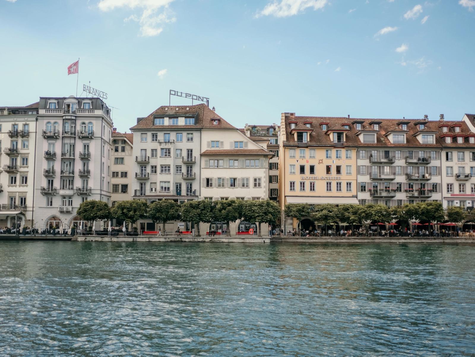 Beautiful view of historic waterfront architecture along the Reuss River in Luzern, Switzerland