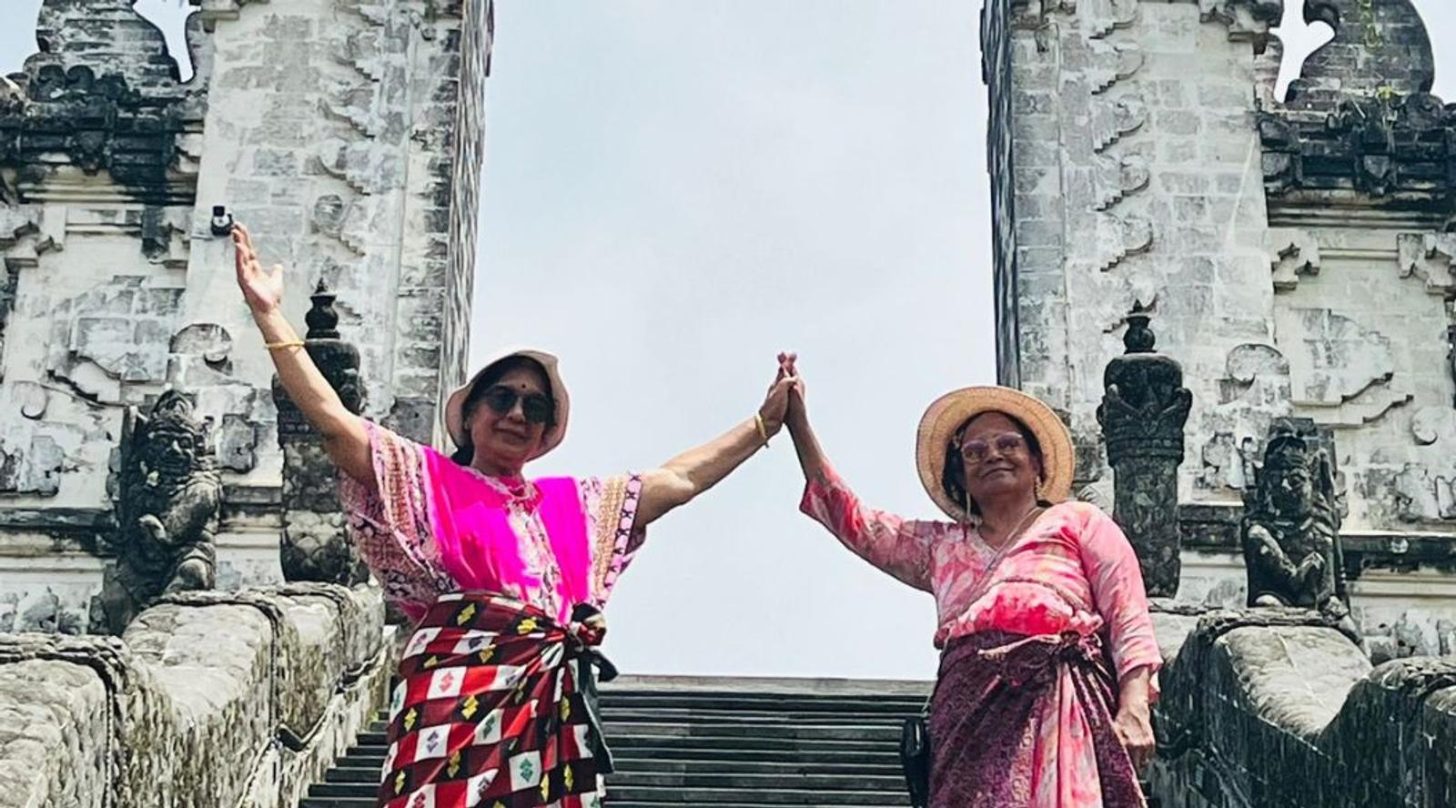 Two women in stand on steps 