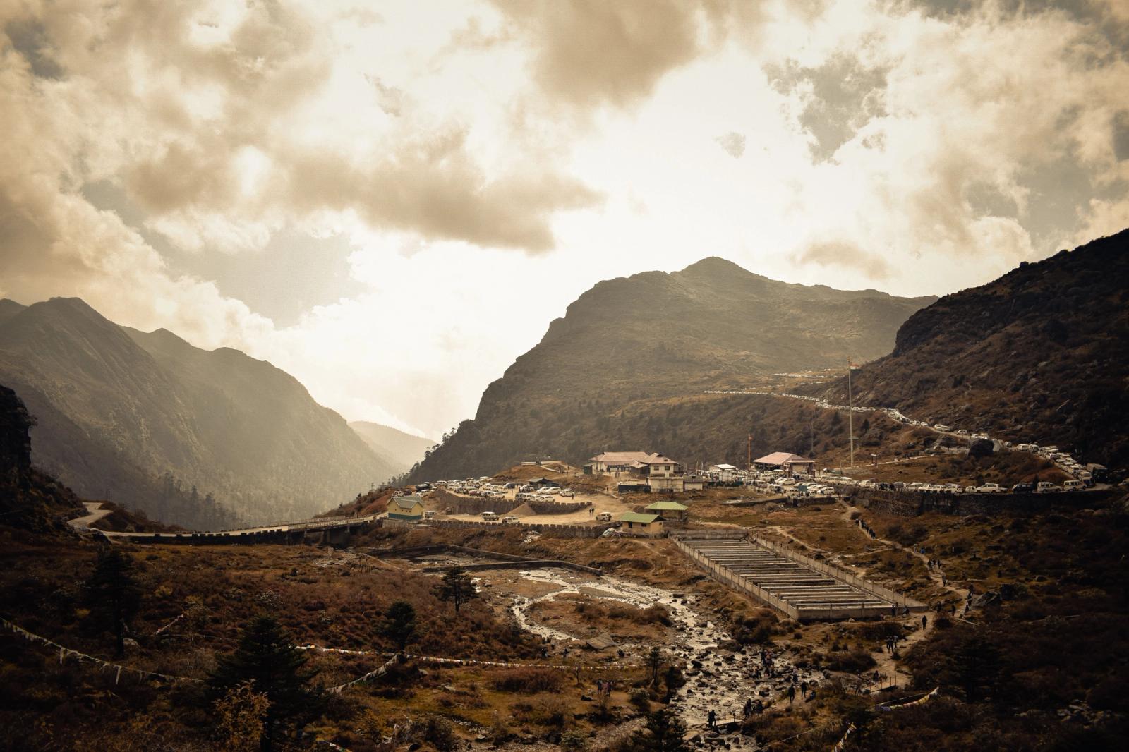 Stunning mountainous landscape in Himachal Pradesh, India with a serene village nestled in a valley
