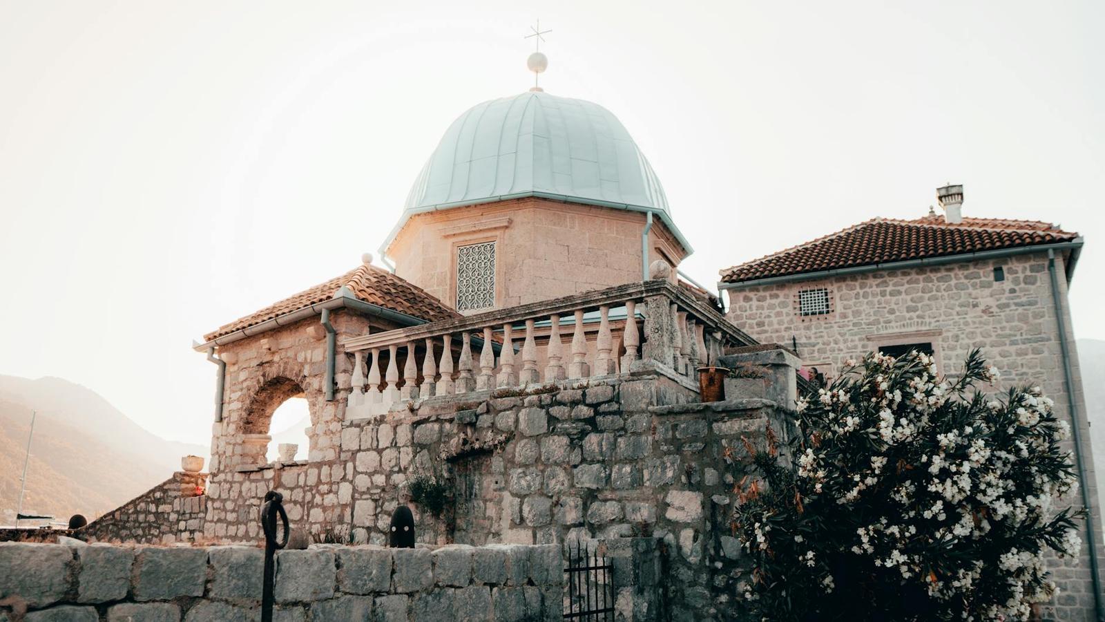 Explore the historic Our Lady of the Rocks Church, a captivating landmark in Montenegro's scenic Bay of Kotor