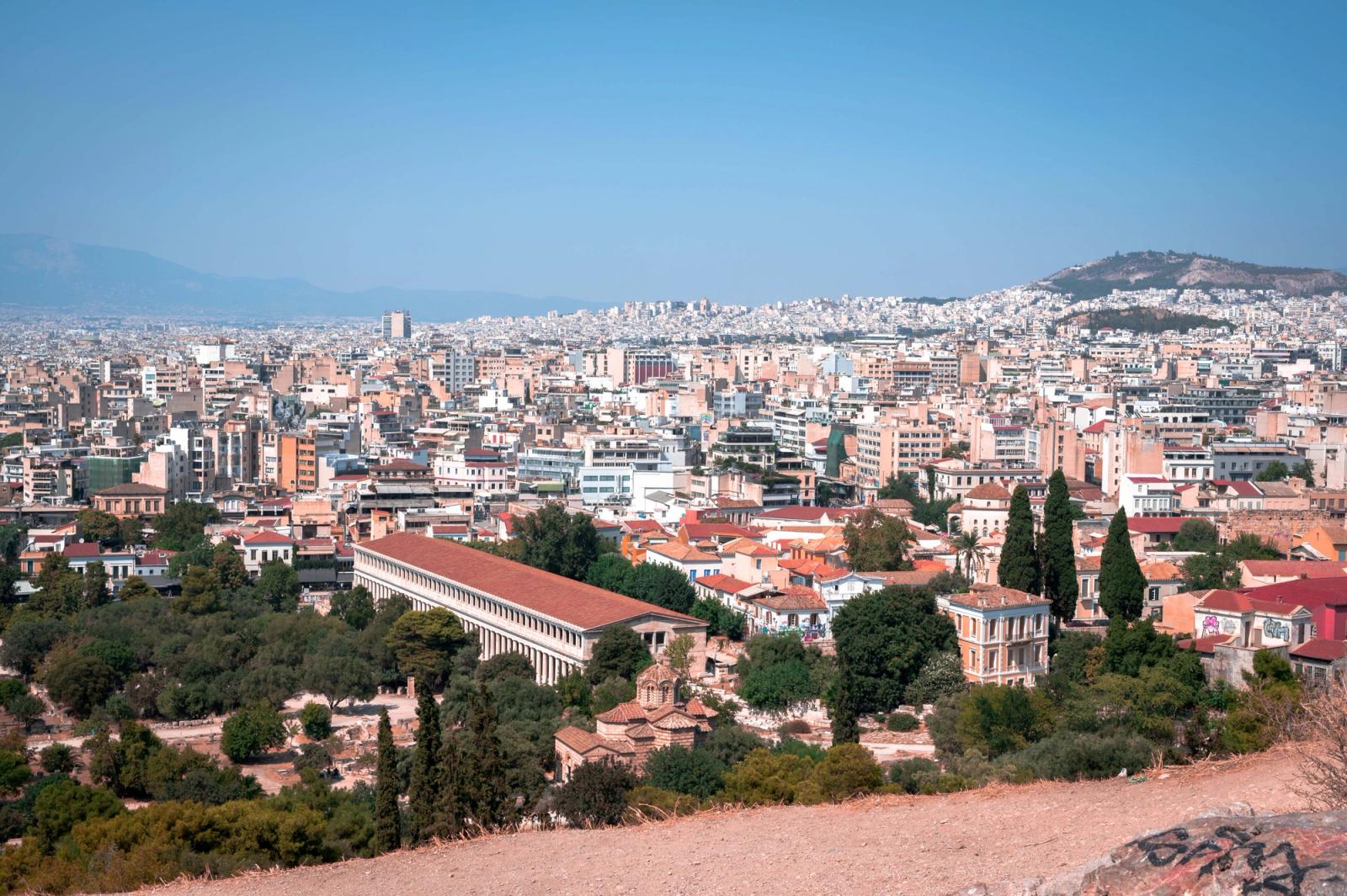 A breathtaking aerial view of Athens cityscape showcasing ancient landmarks and modern architecture