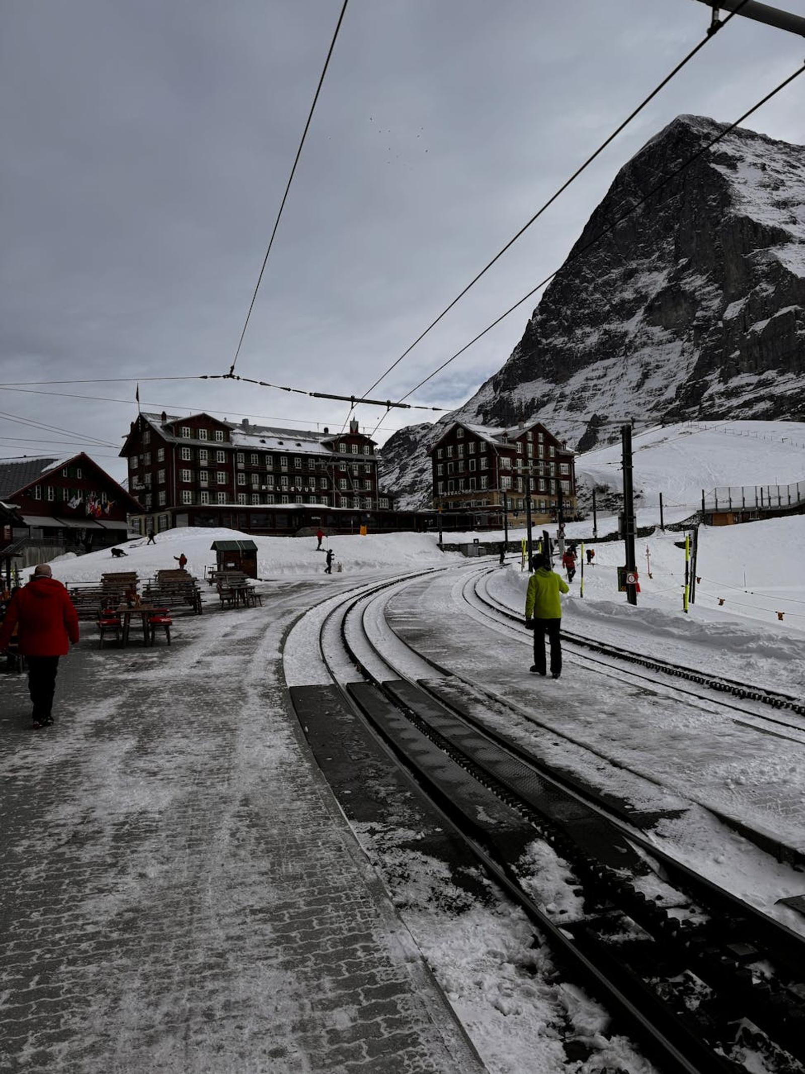 A picturesque winter scene at Jungfraujoch railway station with snowy mountains and charming architecture