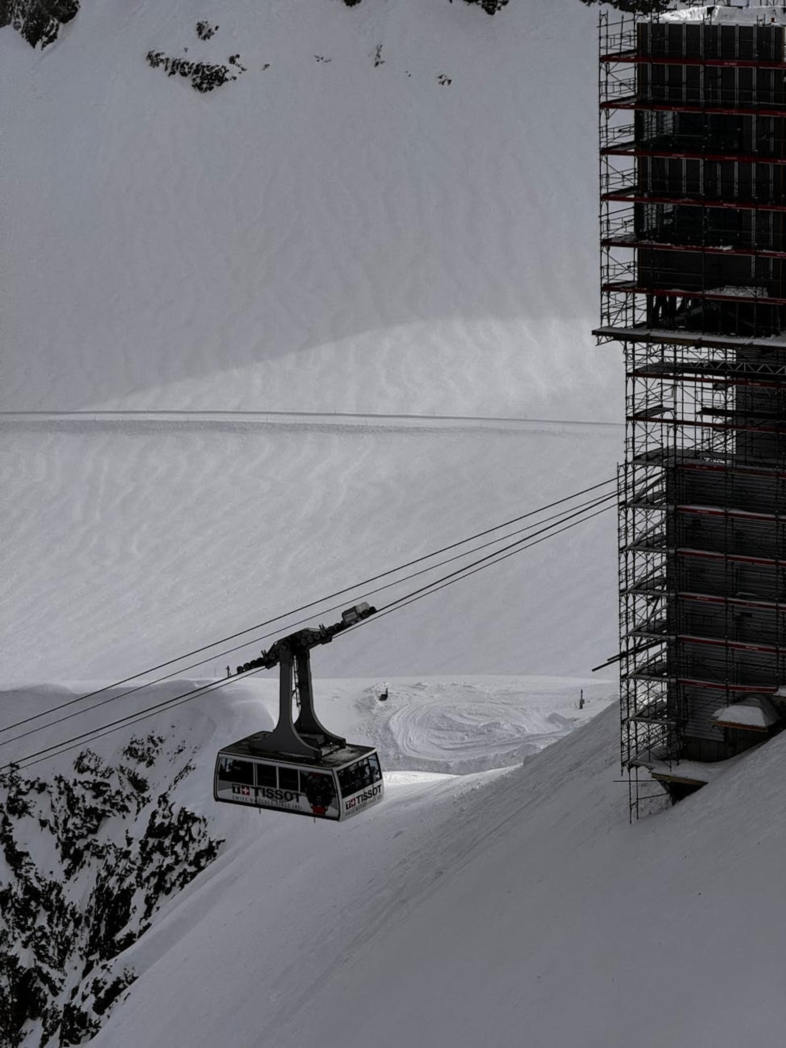 Gondola lift over snowy mountains at Ormont-Dessus, Switzerland