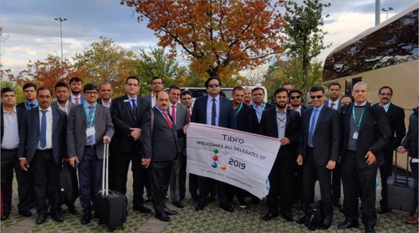 Corporate delegates at the Tibro 2019 event, posing together.