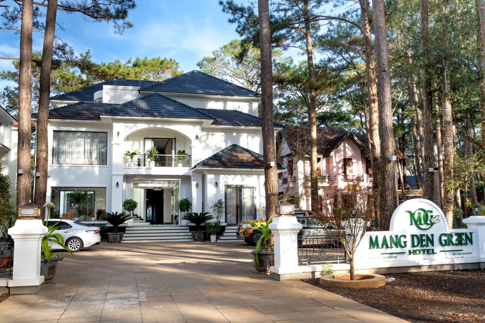 Beautiful entrance of Mang Den Green Hotel surrounded by serene forest. Ideal for luxury stays