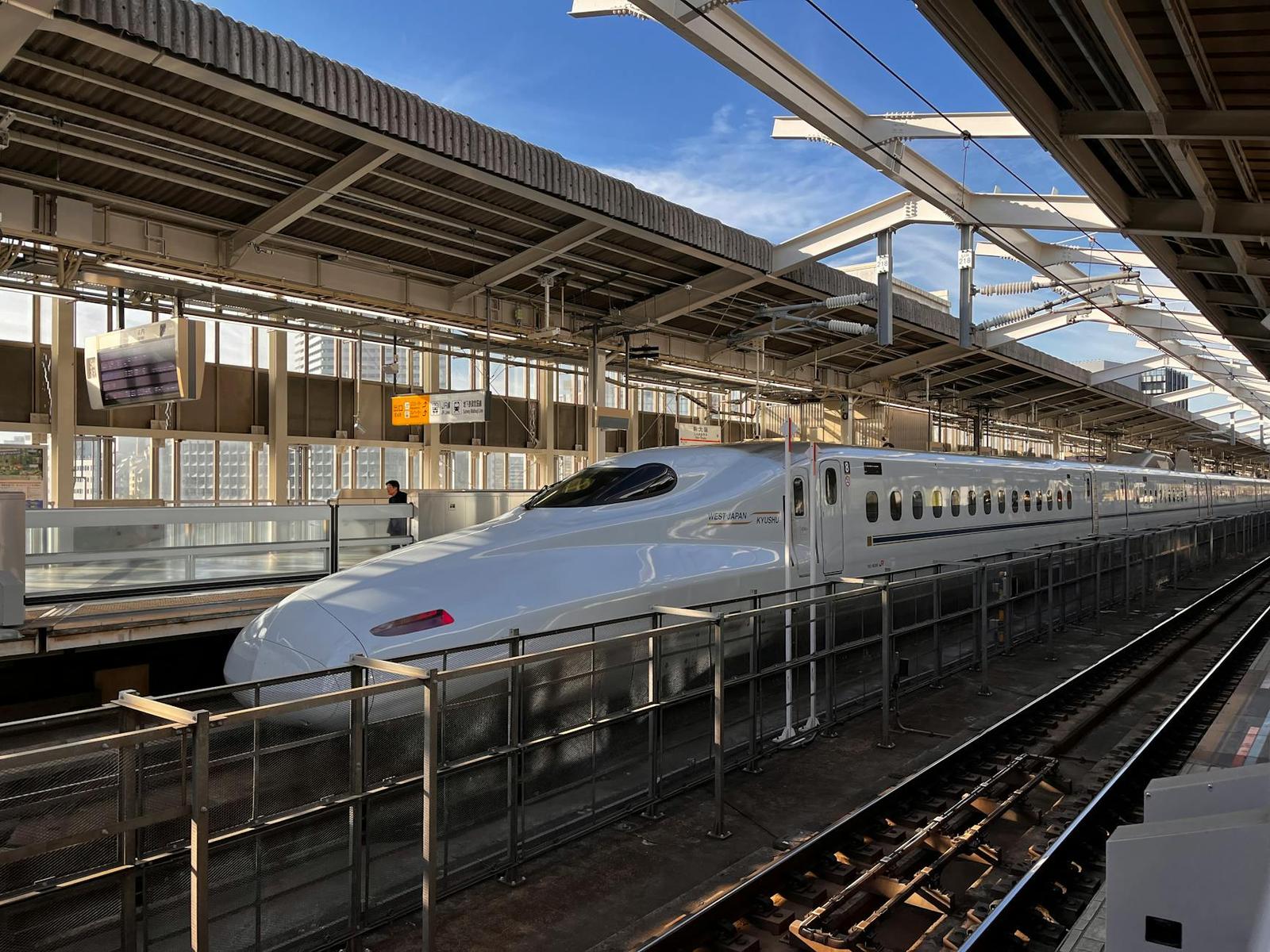 High-speed Shinkansen bullet train at the platform in Osaka, Japan, during daytime