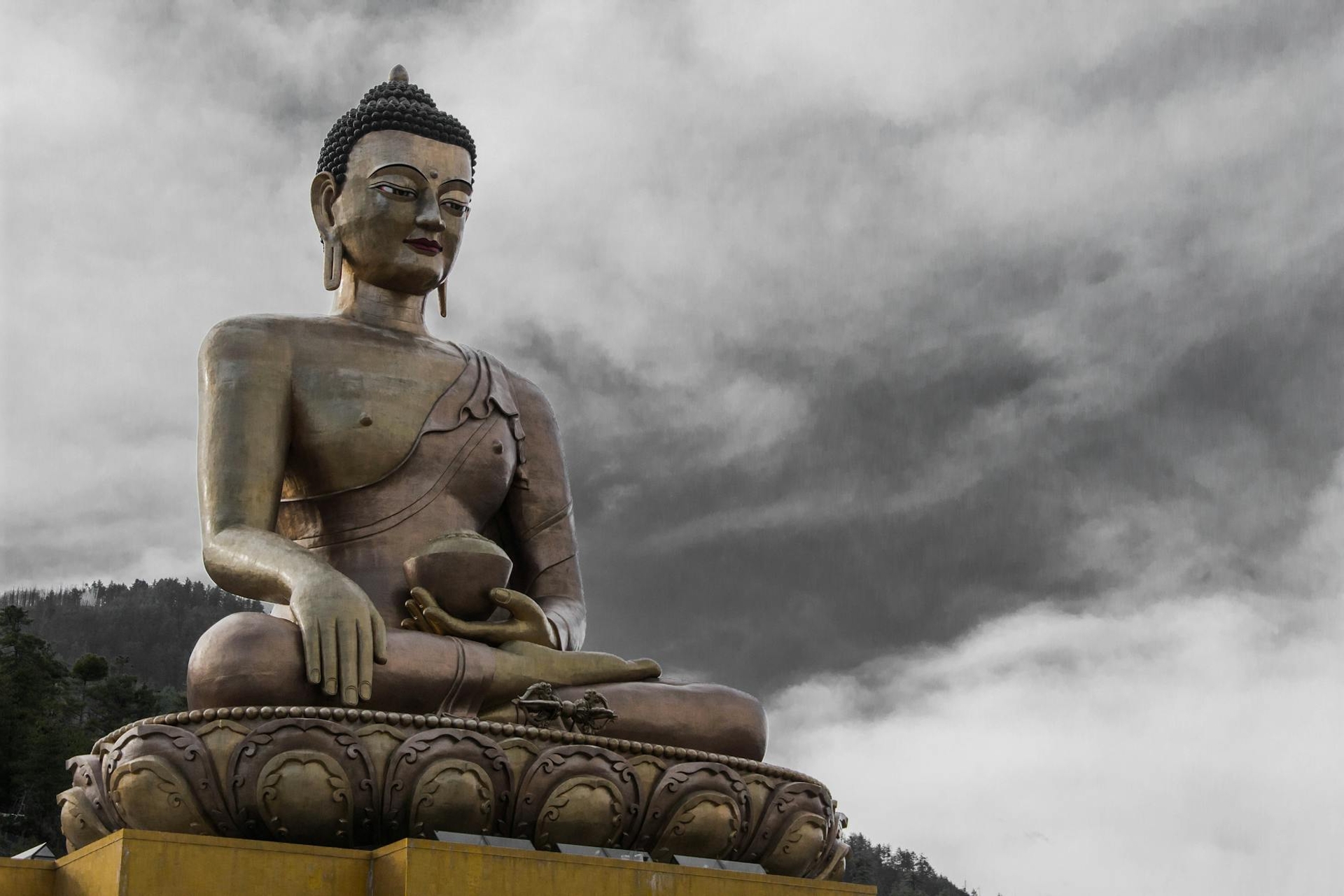 Buddha Dordenma statue against a cloudy sky in Thimphu, Bhutan