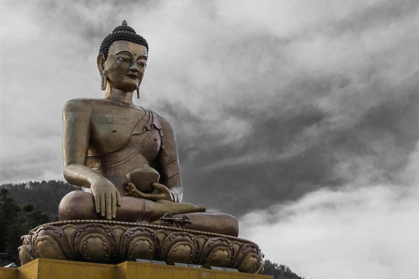 Buddha Dordenma statue against a cloudy sky in Thimphu, Bhutan