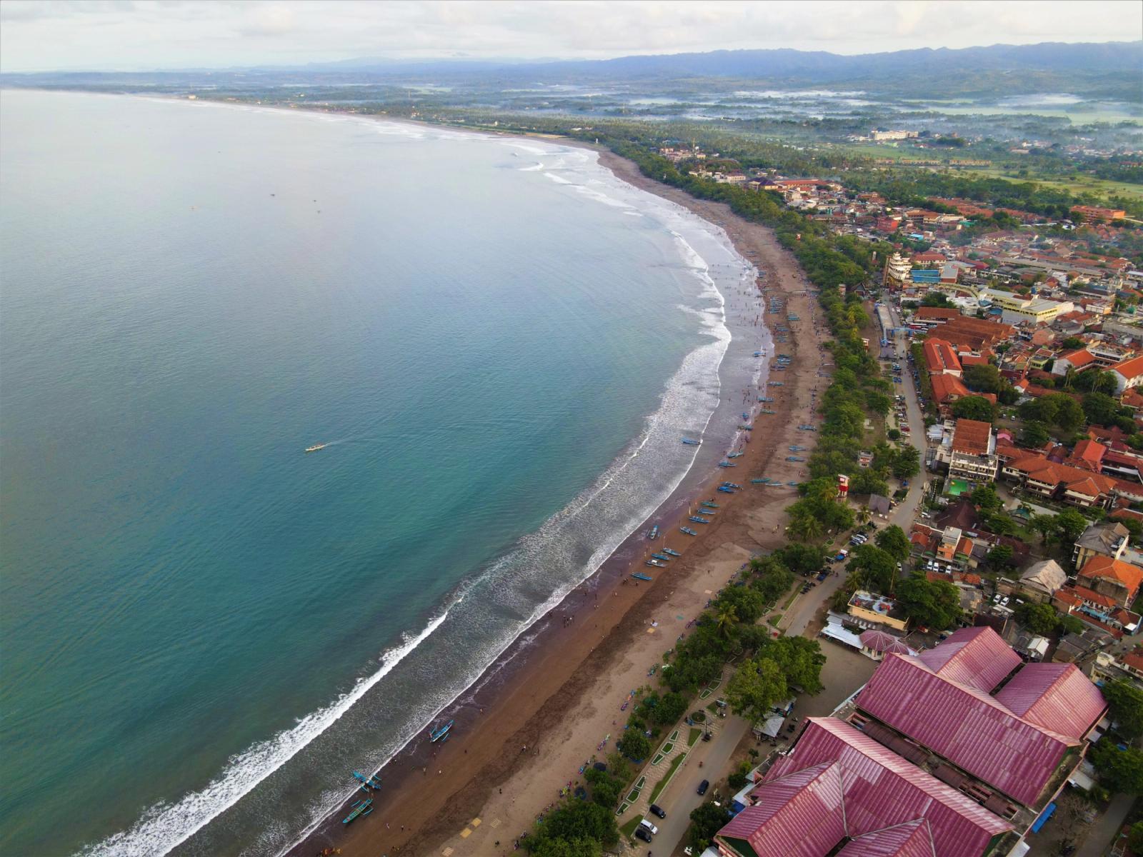 Stunning aerial view of Pangandaran Beach, Indonesia, showcasing its expansive coastline and vibrant town