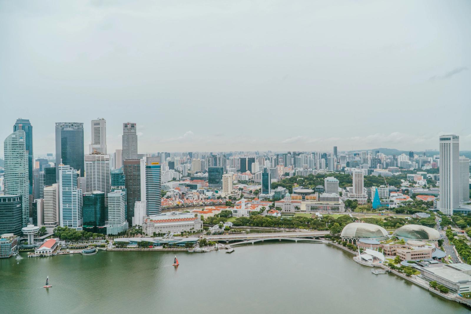 Stunning aerial view of Singapore's skyline and Marina Bay, with iconic landmarks and modern architecture