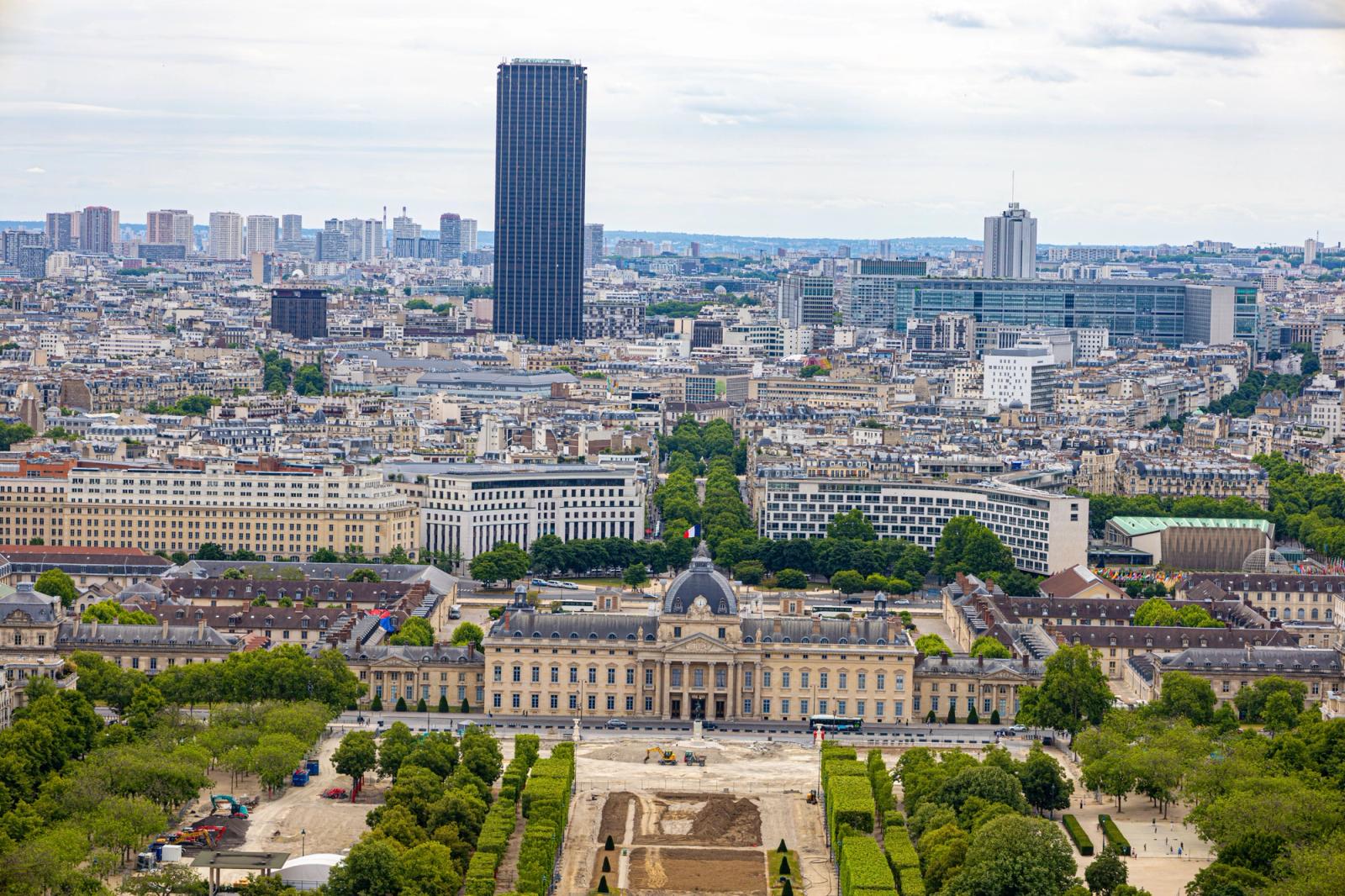 Aerial view of a European capital with a grand hall and a dark skyscraper