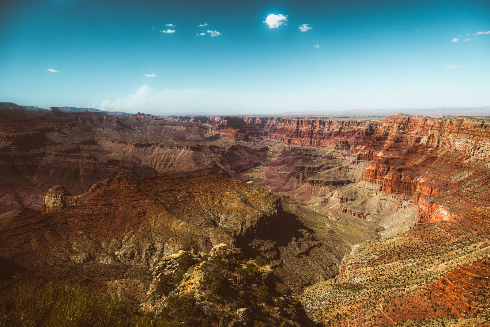 Layered red rock canyon walls stretching to the horizon