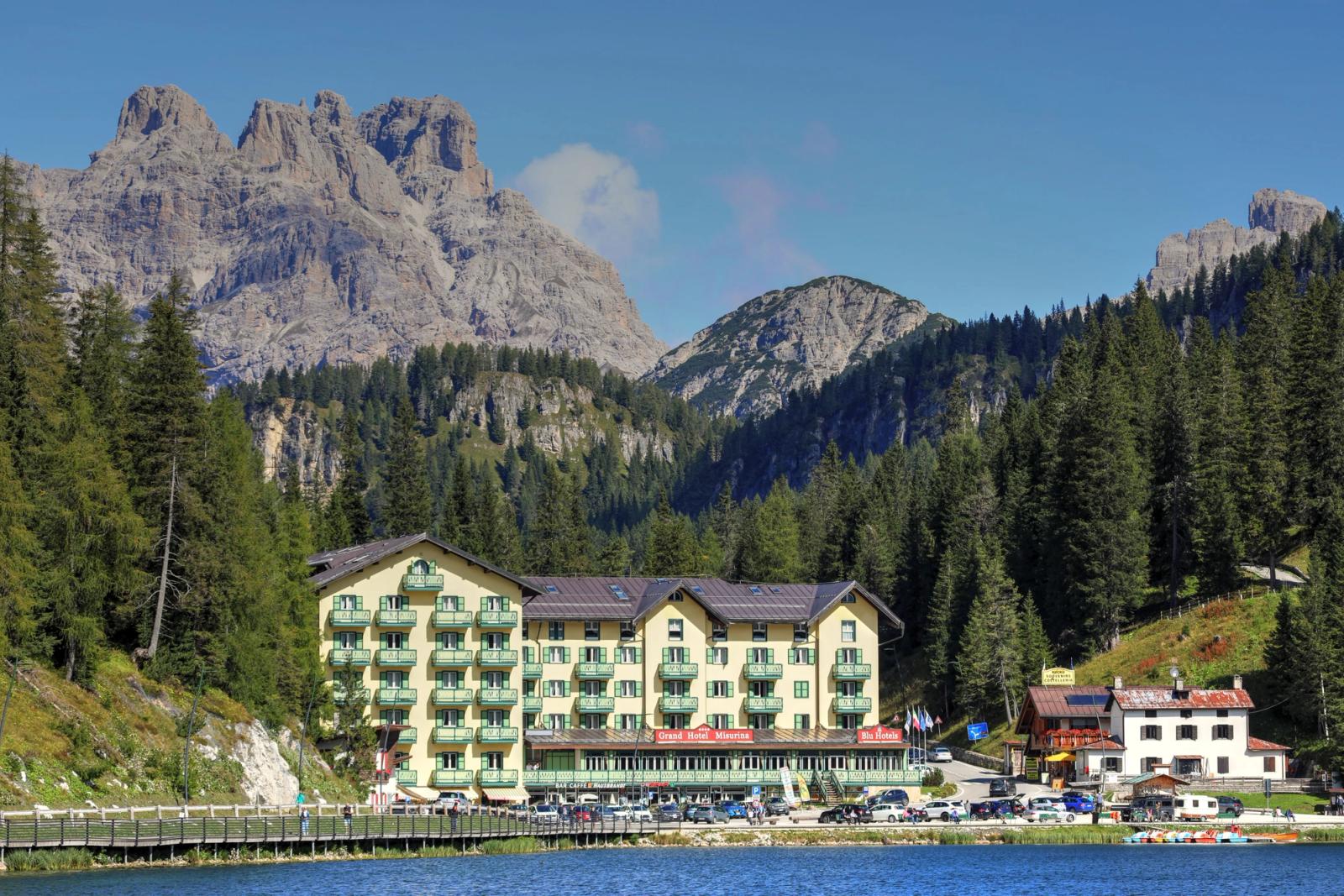 Picturesque view of Grand Hotel Misurina with Dolomite mountains and lake, Veneto, Italy