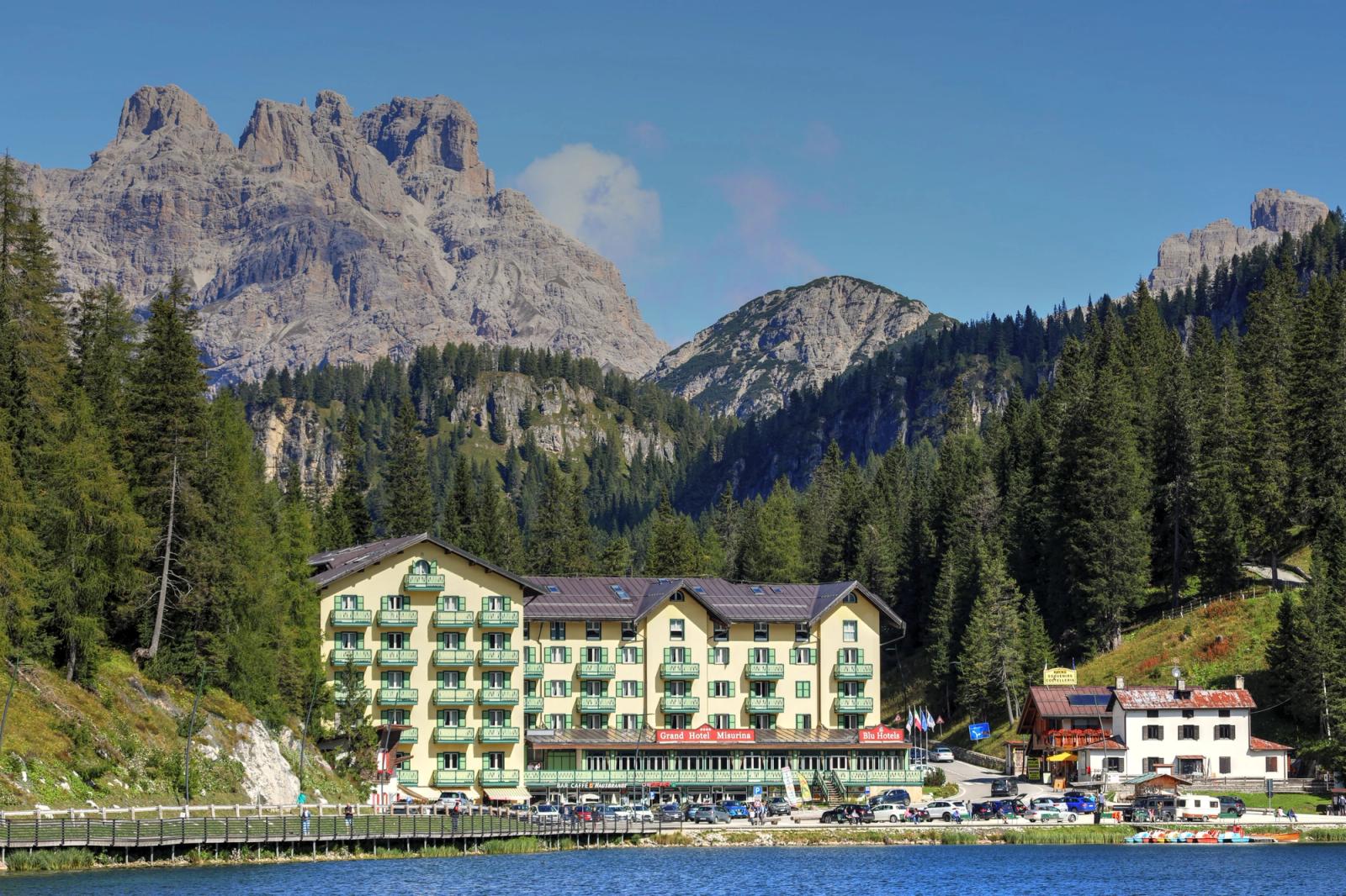 Picturesque view of Grand Hotel Misurina with Dolomite mountains and lake, Veneto, Italy