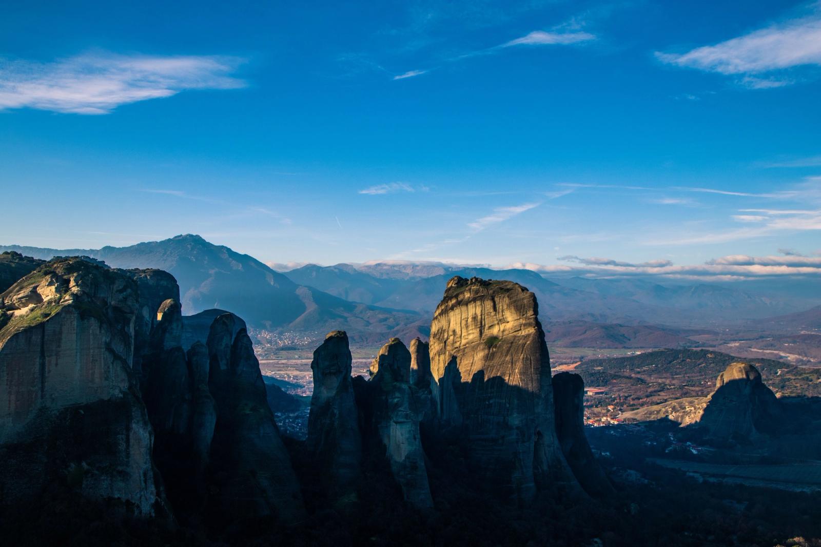 Breathtaking view of Meteora's towering rock formations during sunset in Greece