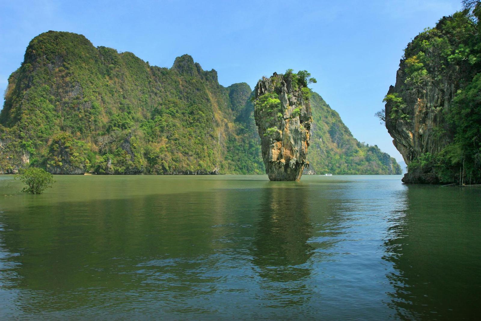 Limestone karst rising from a calm turquoise lagoon