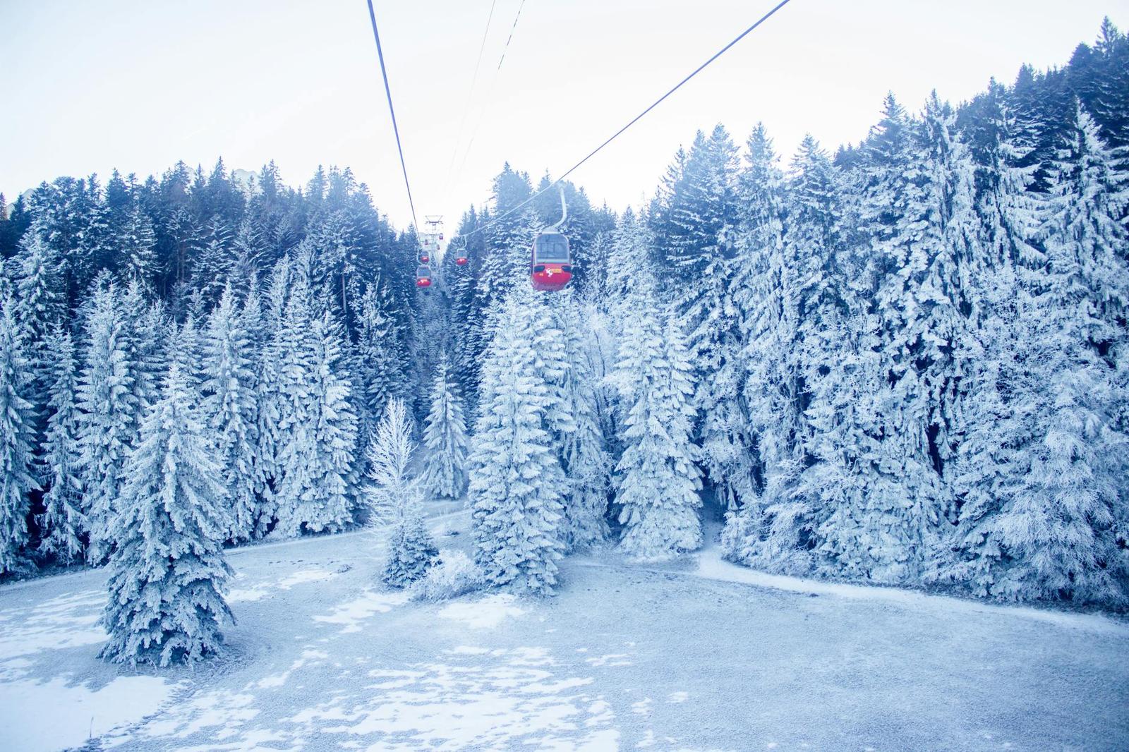 Beautiful snow-covered landscape with a cable car in the Swiss Alps during winter