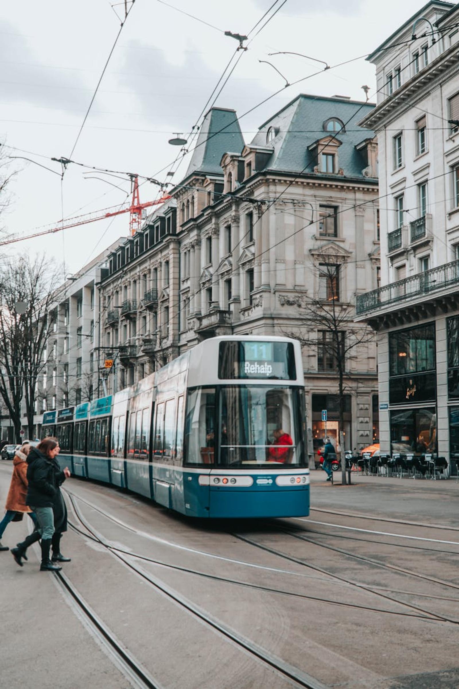 Tram moving through a bustling Zurich street