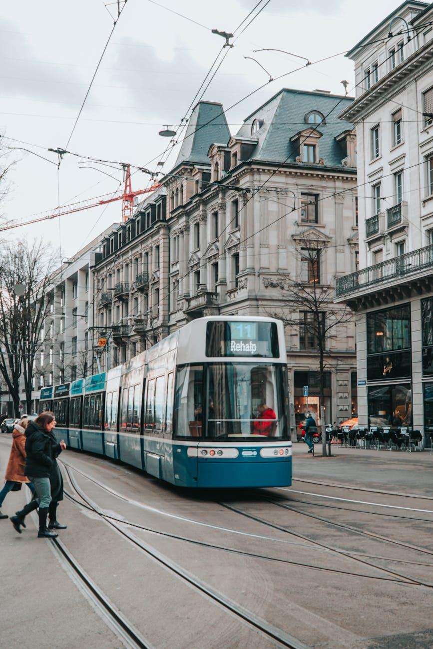 Tram moving through a bustling Zurich street