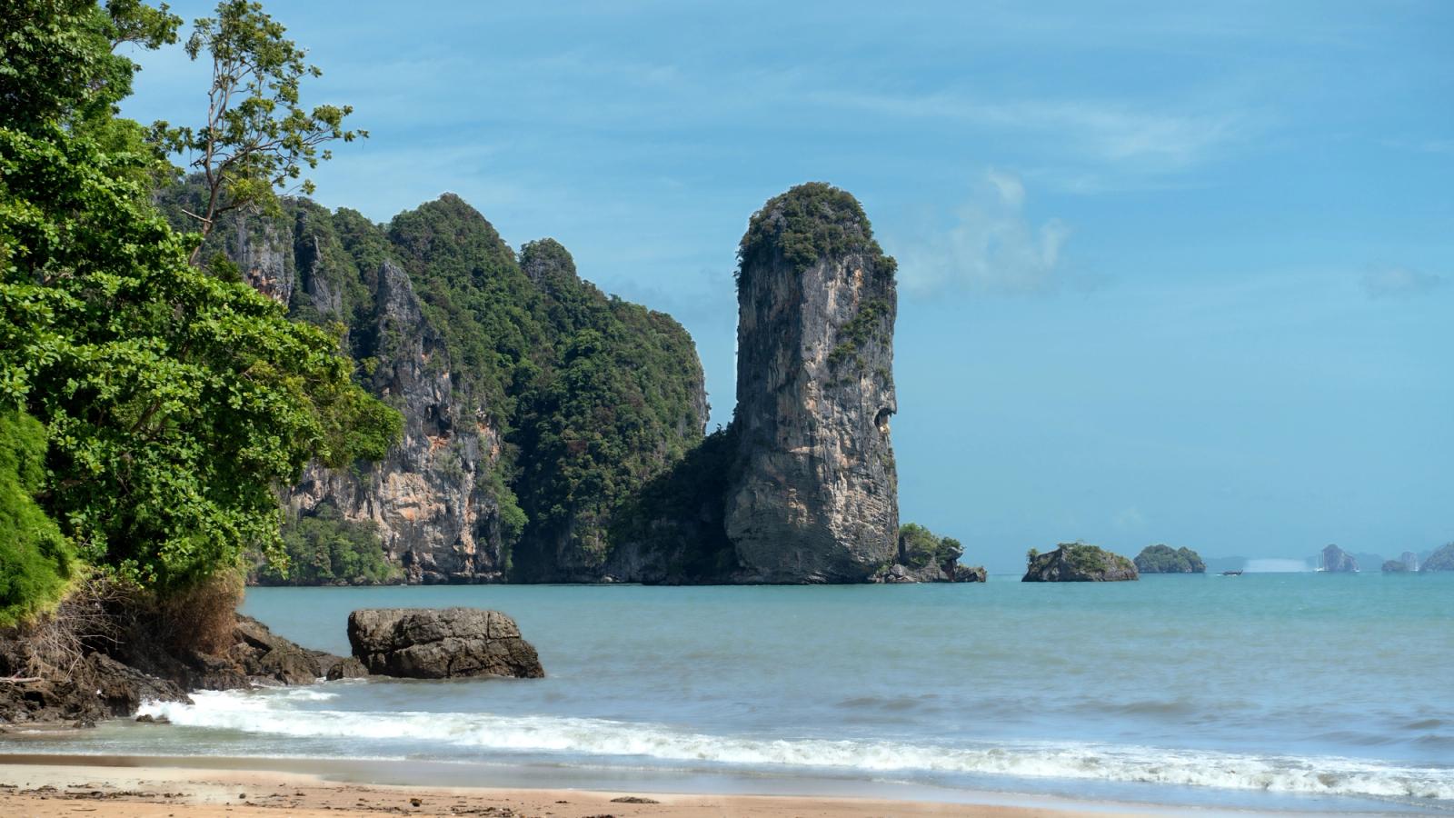 Majestic limestone cliffs and blue sea at Ao Nang Beach, Krabi, perfect for tropical travel inspiration