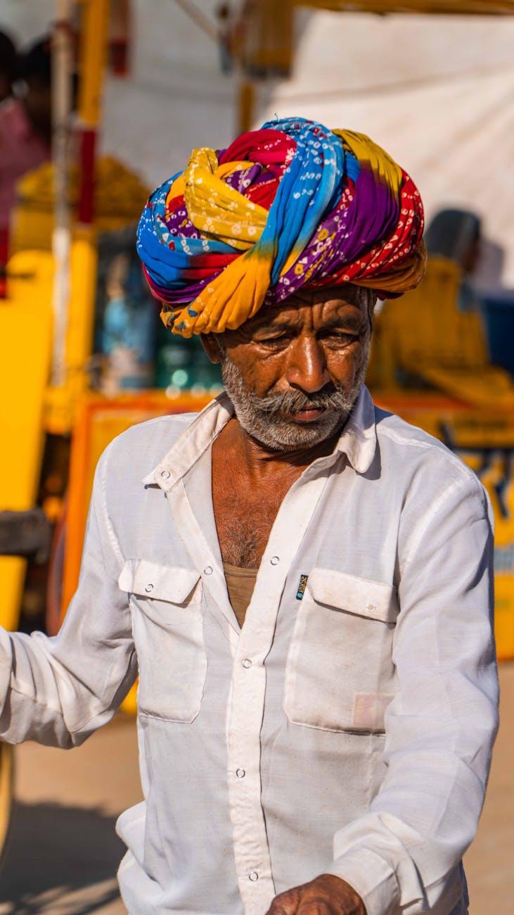 Close-up of an elderly Rajasthani man wearing a colorful turban in Pushkar, India