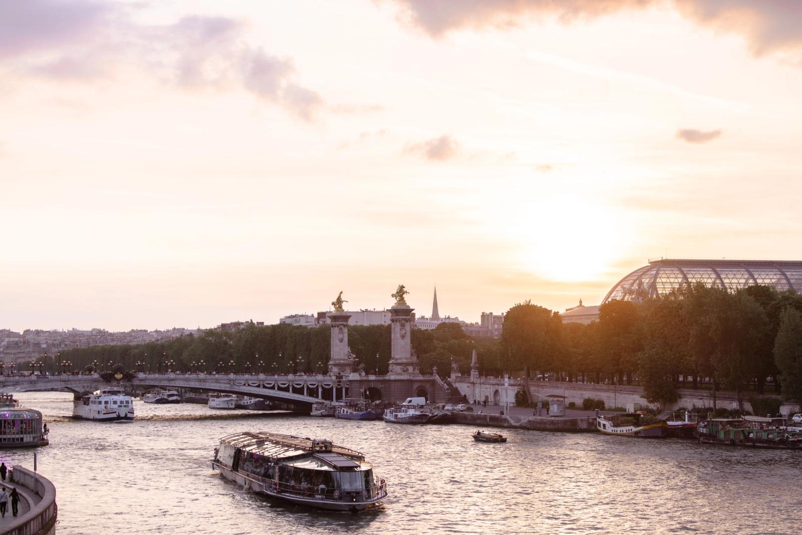 Scenic view of Paris with the Seine River and iconic architecture during sunset