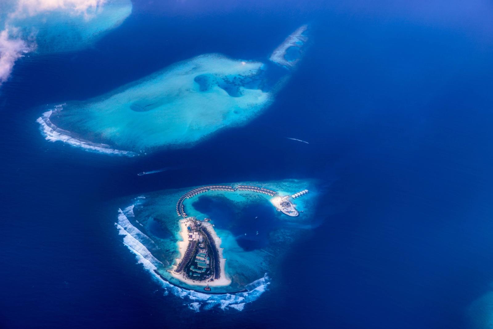 Stunning aerial view of turquoise waters and islands in the Maldives