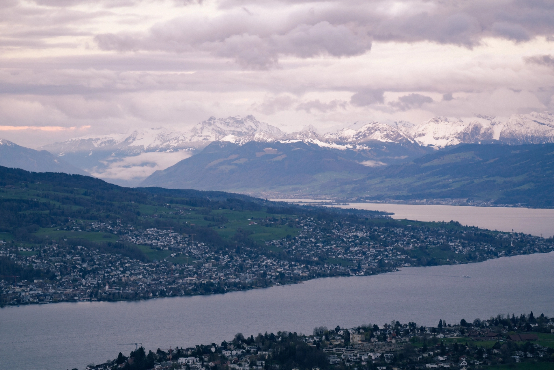 Panoramic view of Zurich with Lake Zurich and the snow-capped Swiss Alps in the background
