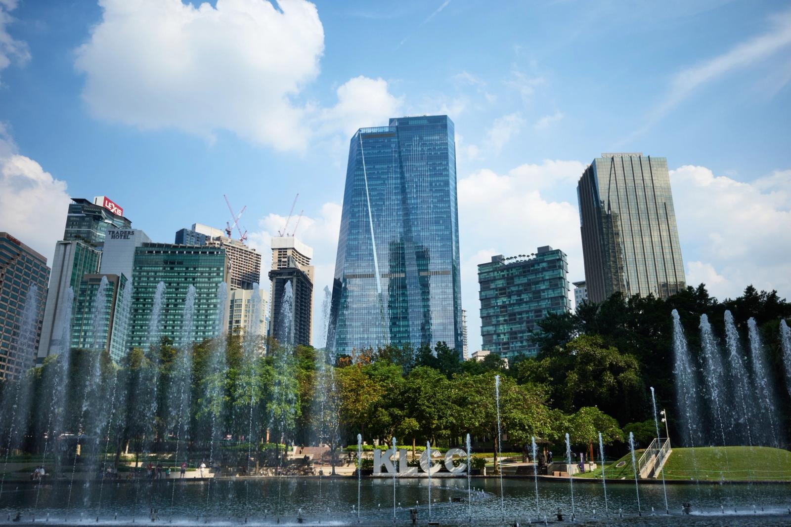 Capture of the iconic Kuala Lumpur skyline with fountains in the foreground