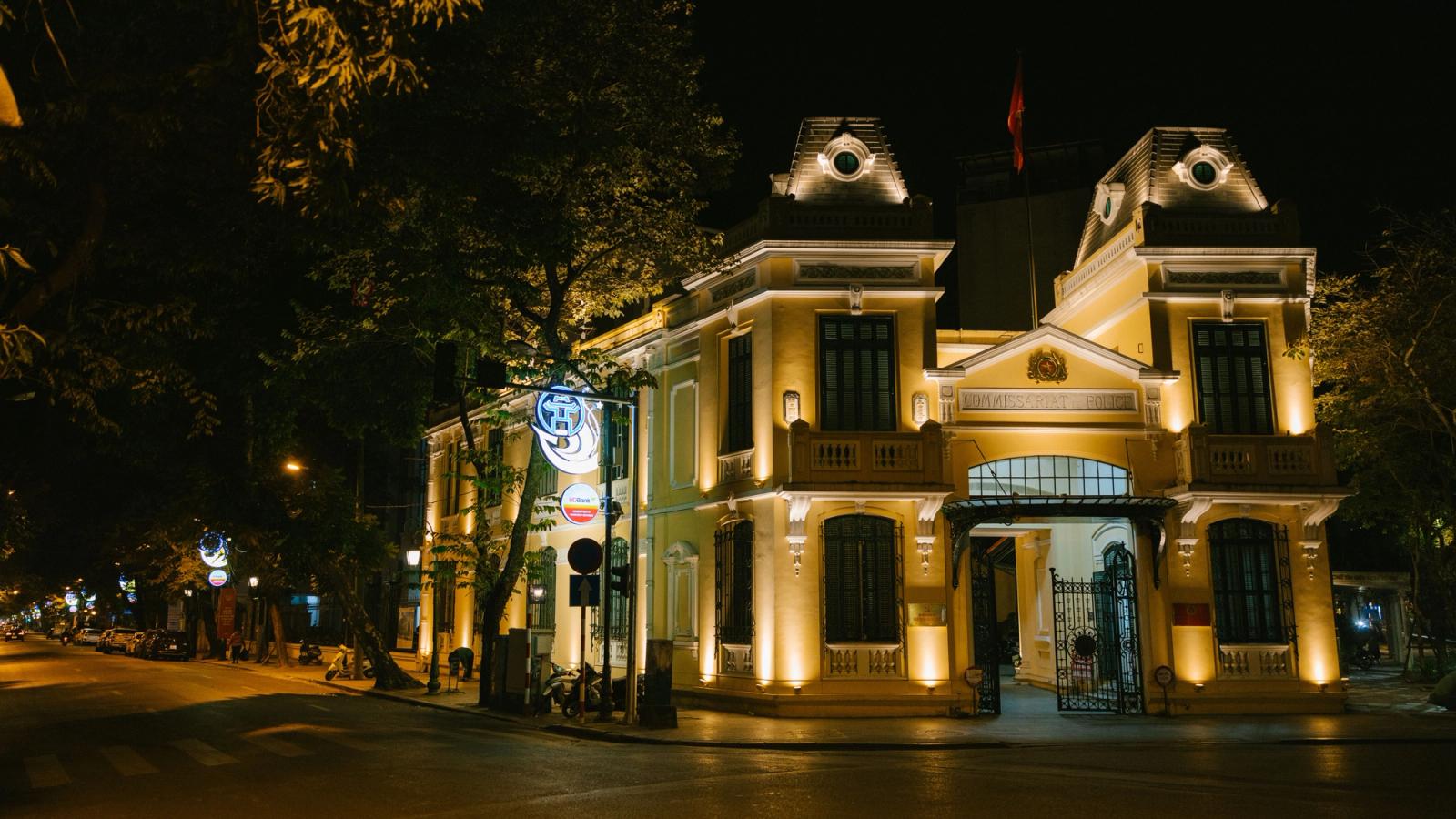 Beautifully lit colonial-style building in Hanoi, Vietnam at night