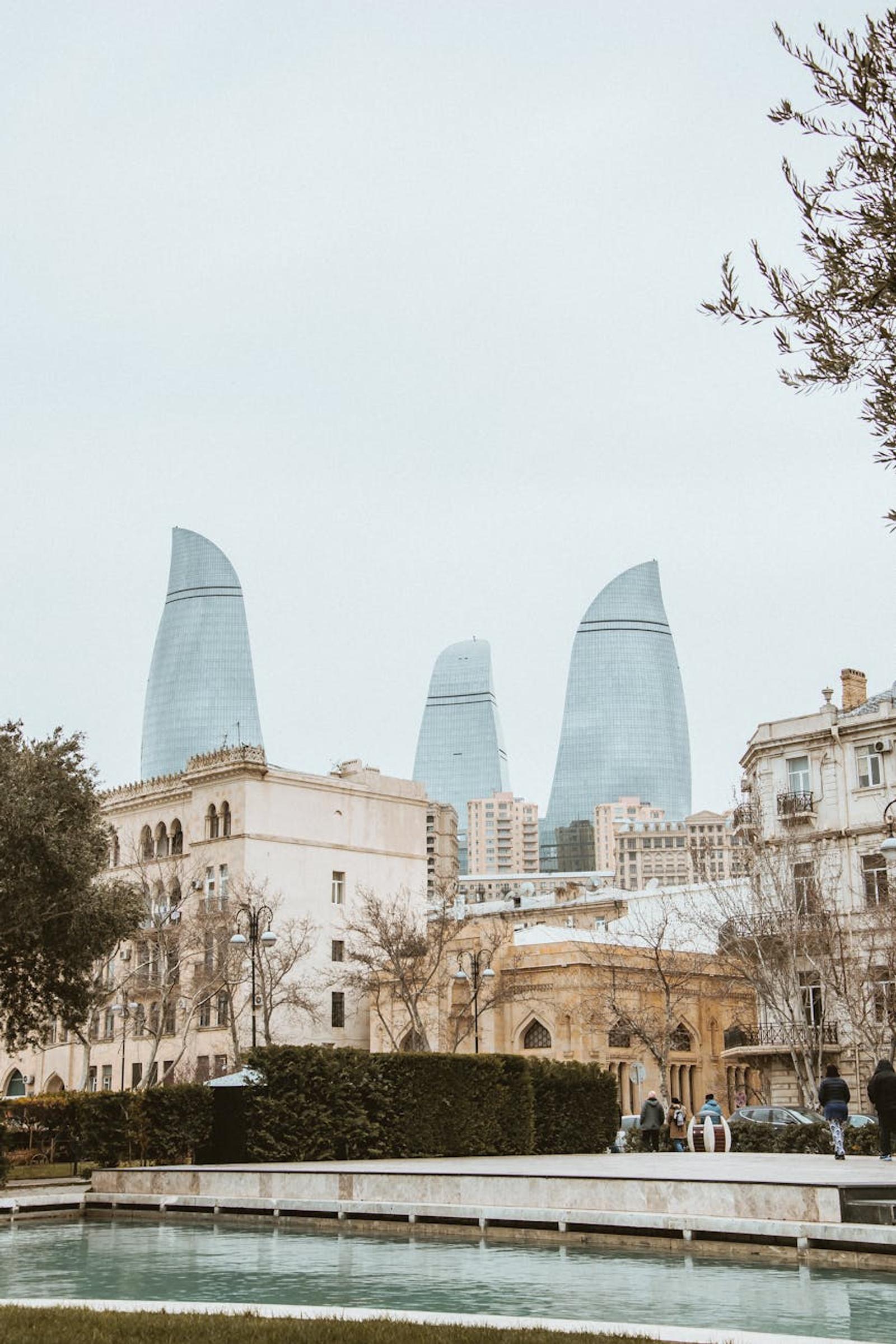 View of Baku's skyline featuring the Flame Towers and historical buildings