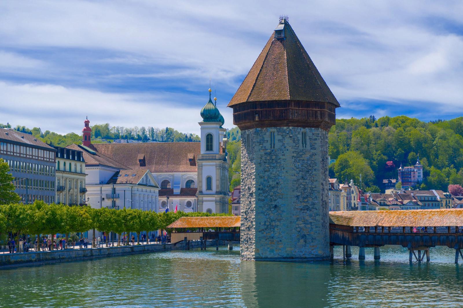Scenic view of Chapel Bridge and water tower with the Jesuit Church in Lucerne, Switzerland