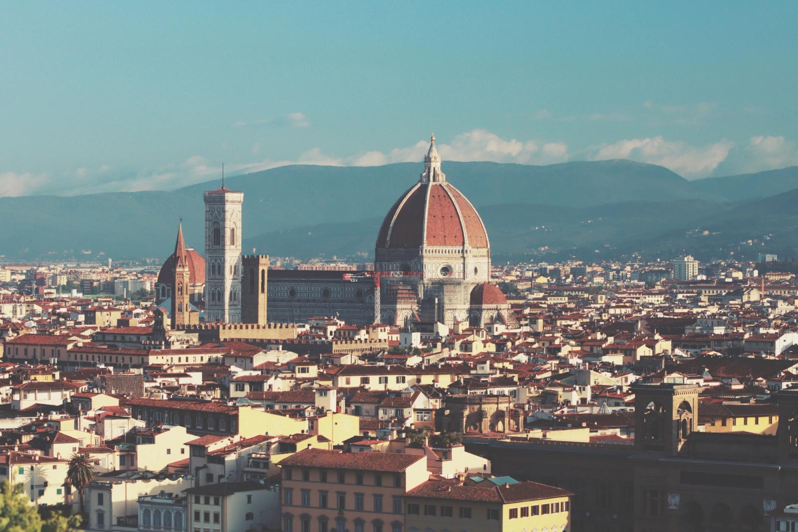 Panoramic view of Florence, Italy featuring the iconic Duomo and historic architecture under a clear sky
