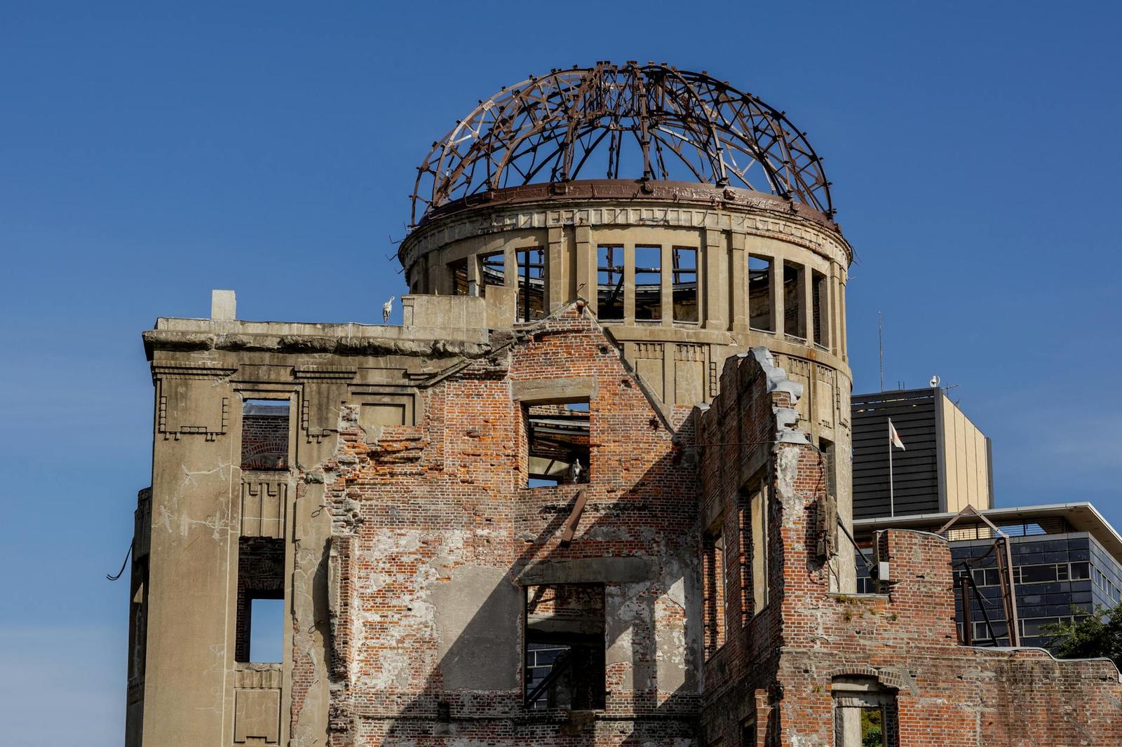 Close view of a brick ruin topped with a skeletal iron dome frame