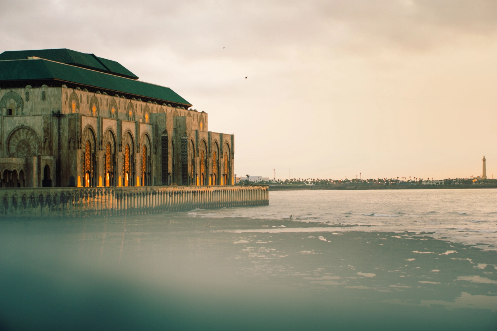 The Hassan II Mosque in Casablanca at sunset with its stunning architecture by the sea