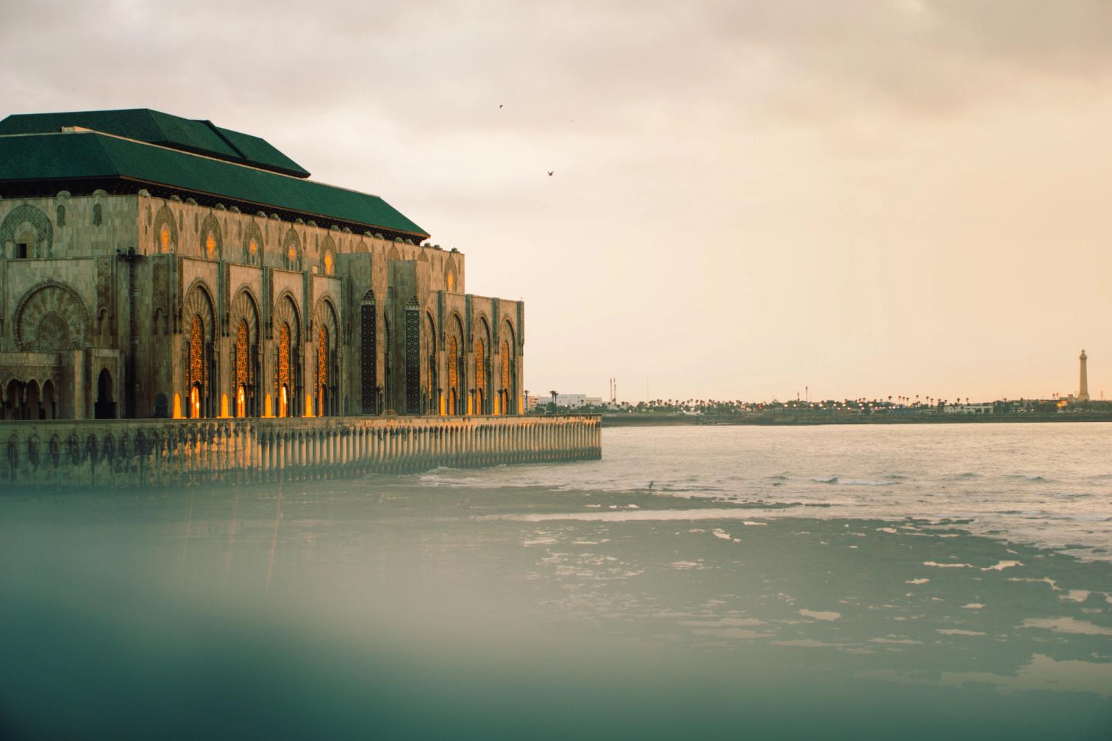 The Hassan II Mosque in Casablanca at sunset with its stunning architecture by the sea