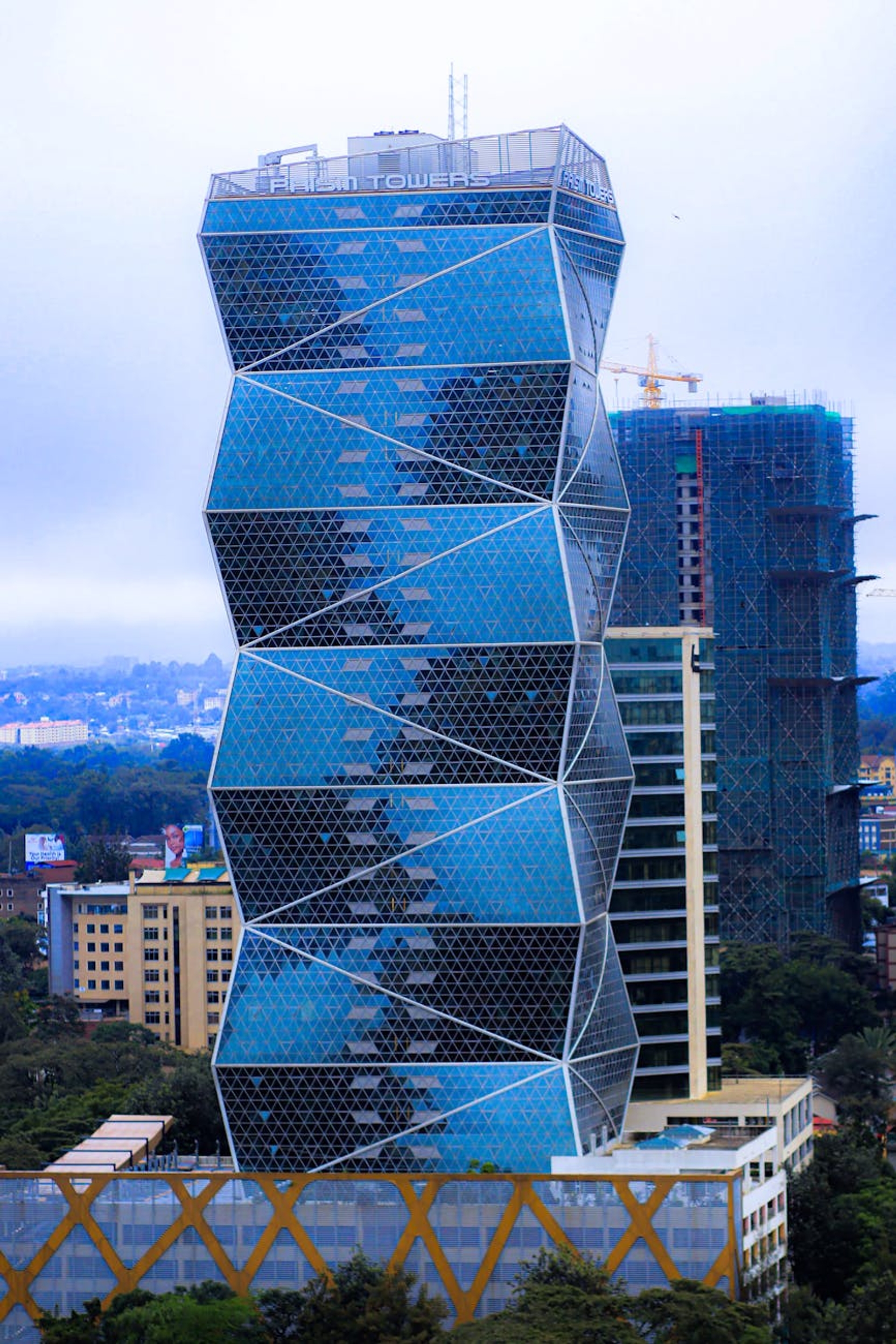 A modern skyscraper with a unique facade in Nairobi's central business district