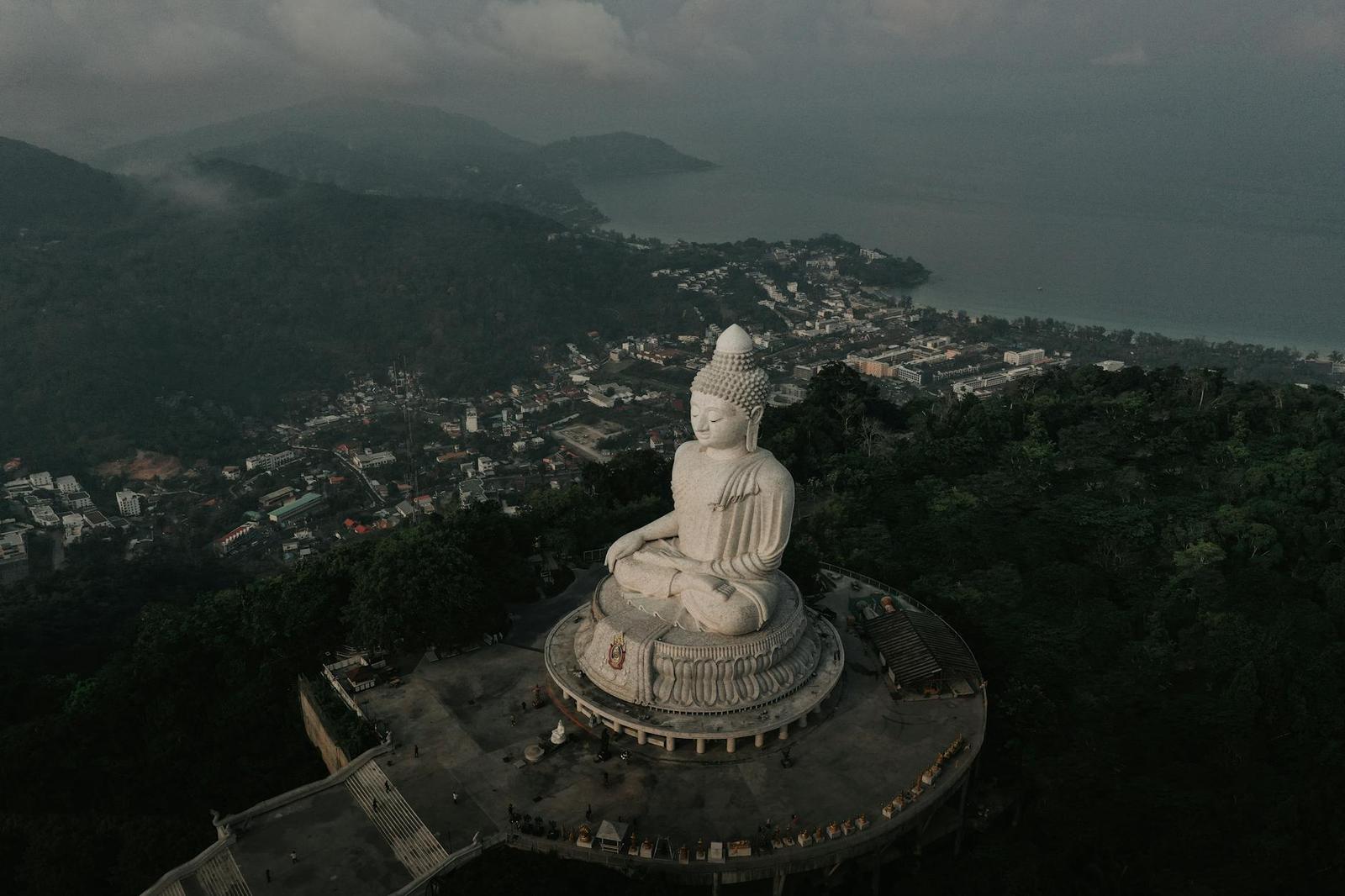 Captivating aerial shot of the iconic Big Buddha statue overlooking Phuket, Thailand's lush landscape