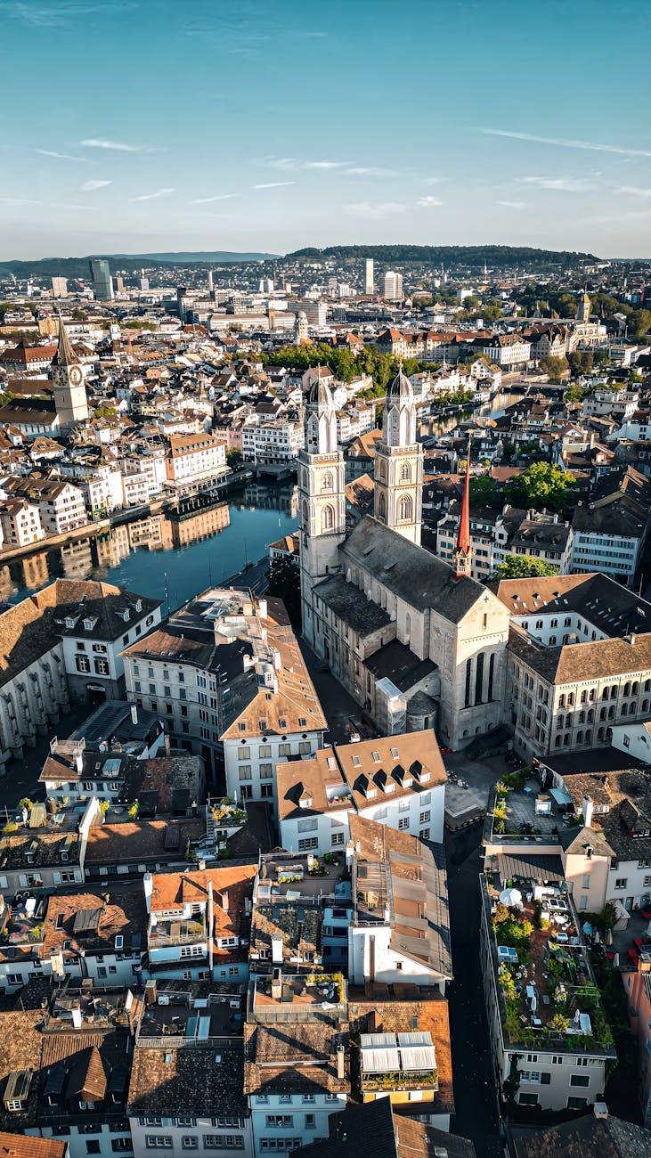Stunning aerial shot of Zürich's cityscape highlighting the historic Grossmünster church
